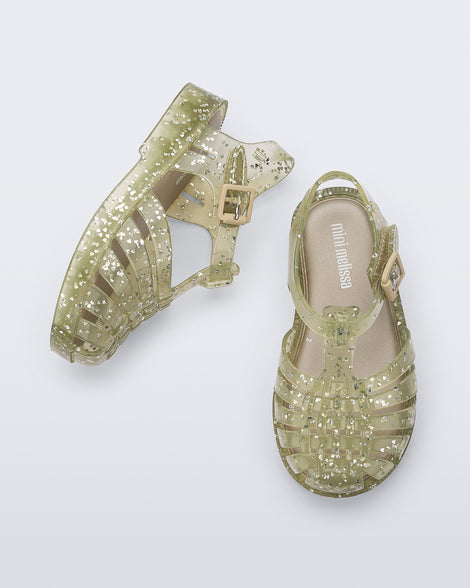 Top and side view of a pair of yellow Possession Elements baby sandal with glitter hearts