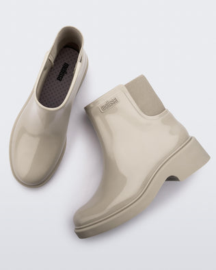 top and side view of a pair of beige Chelsea boots