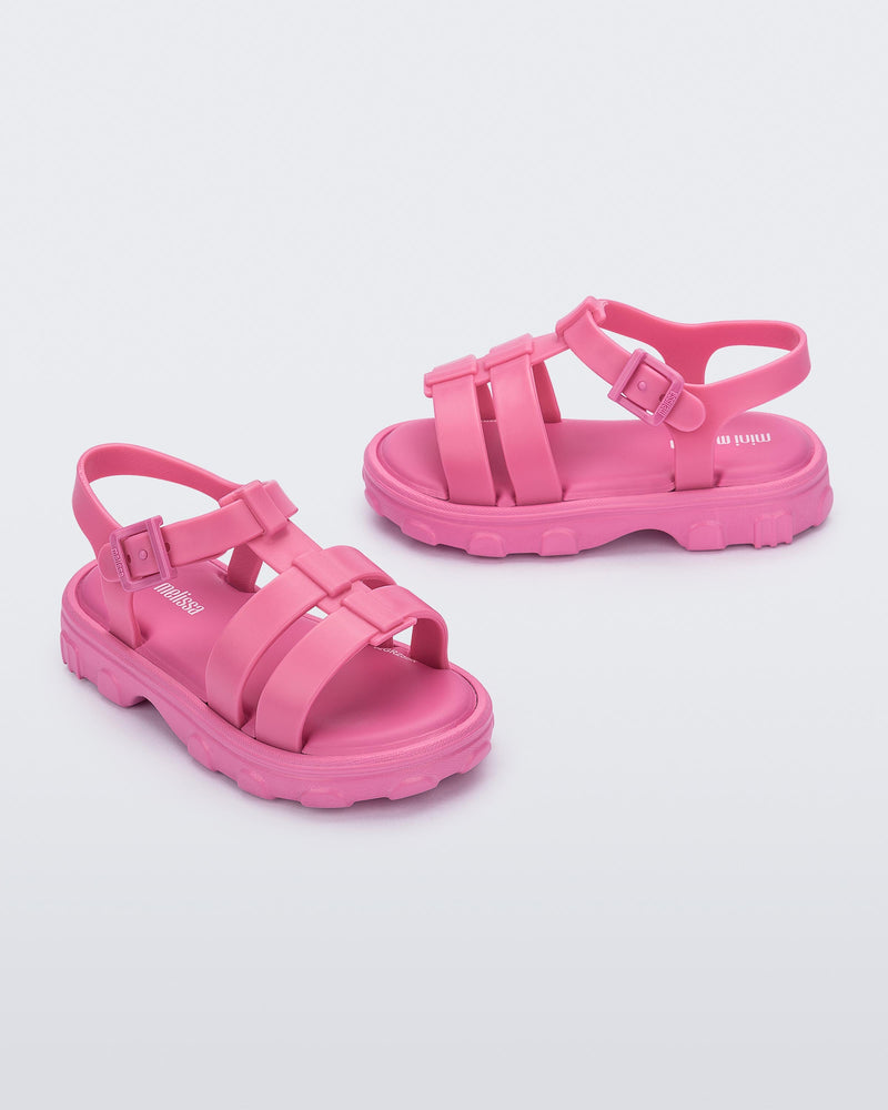 Side and angled view of a pair of pink Ella baby sandals