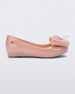 Side view of a Mini Melissa Ultragirl peeptoe ballet flat in pink with star printed butterfly bow applique. 