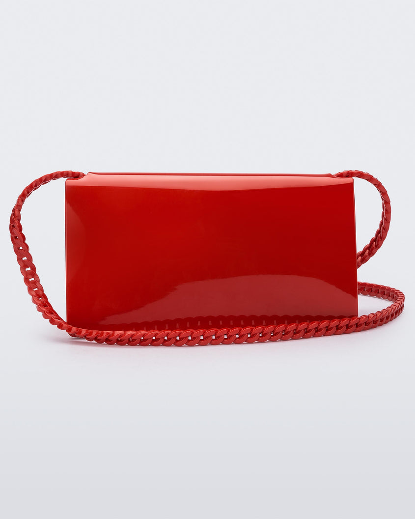 Back view of the Melissa party handbag in red with braided strap.