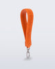 Angled view of a orange M Lover Charm with the Melissa logo