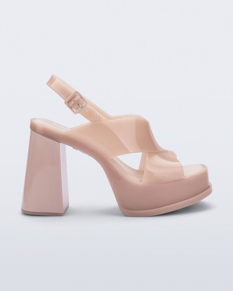 Side view of a milky pink Dance Heel platform with back adjustable strap