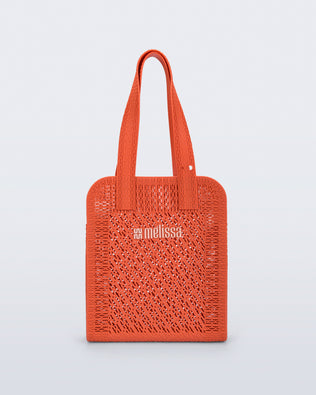 Front view of an orange Harper bag with shoulder straps