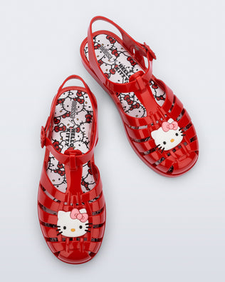 Top view of a pair of red Possession + Hello Kitty and Friends fisherman sandals with Hello Kitty and friends on the upper
