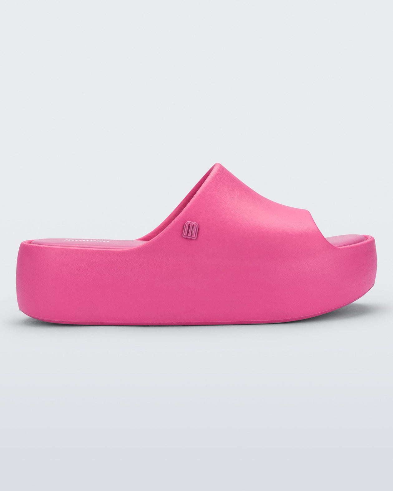 Side view of the pink Free Platform women's slide