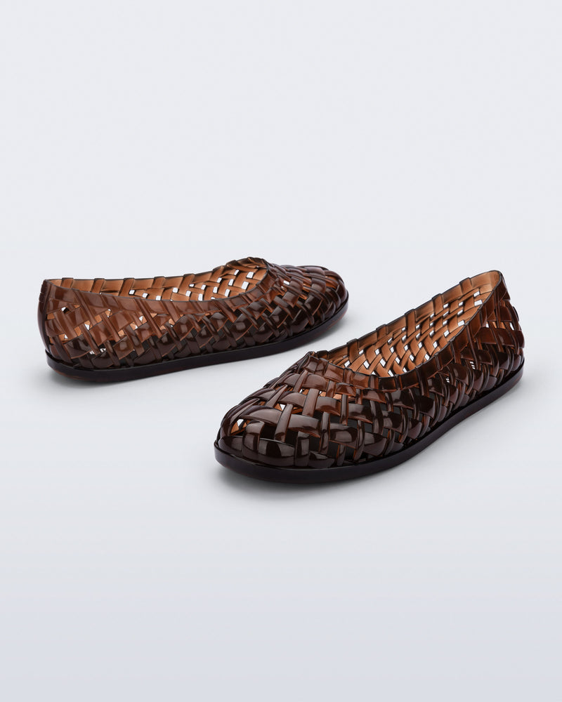 Side and angled view of a pair of brown Possession Ballerina flats