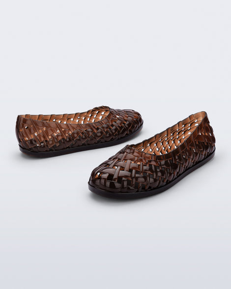 Side and angled view of a pair of brown Possession Ballerina flats