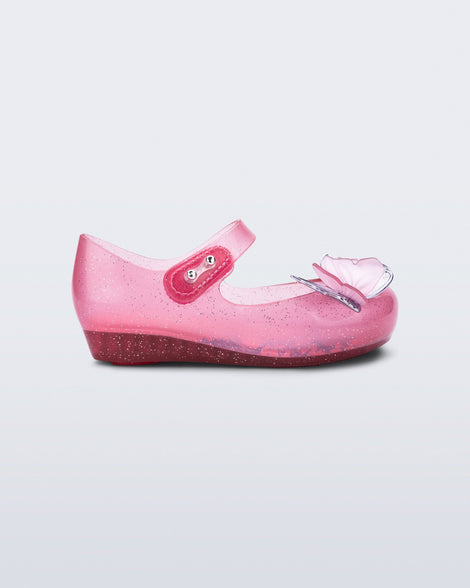 Side view of a pink glitter Ultragirl Butterfly baby flat with pink butterflies on top