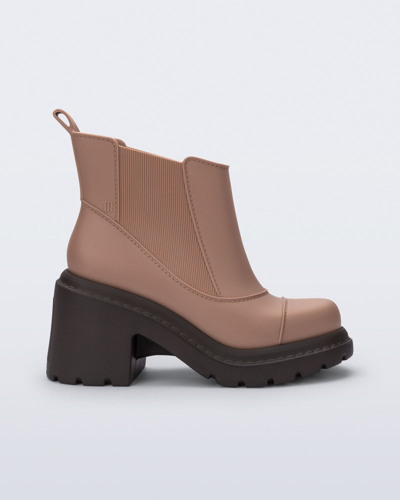 Side view of a brown Courtney boot with dark heeled sole