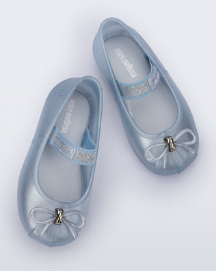 Top view of a pair of pearly blue Sophie baby ballerina flats with bow
