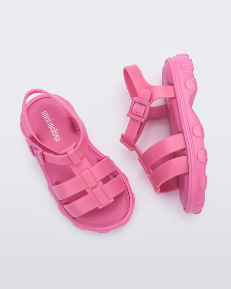 Side and top view of a pair of pink Ella baby sandals