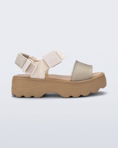 Side view of a beige/glitter Kick Off Sandal