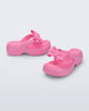 Side and angled view of a pair of pink Free Fuzzy Platform flip flops
