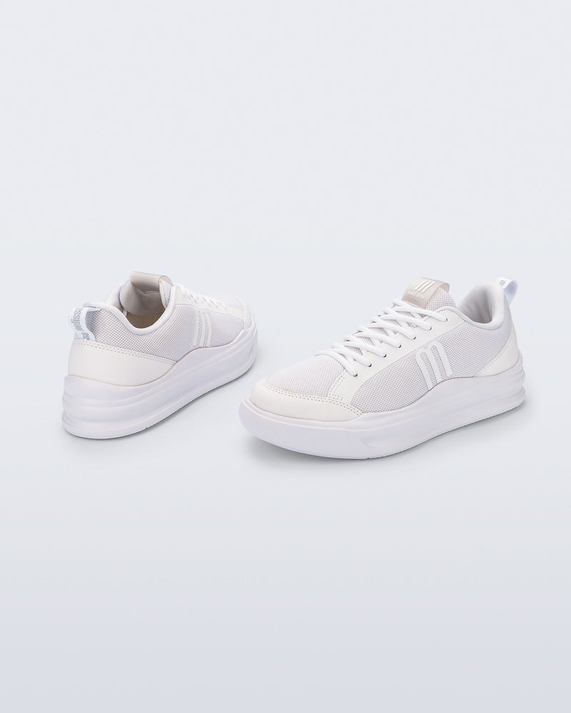 Back and angled view of a pair of white X Mood sneakers