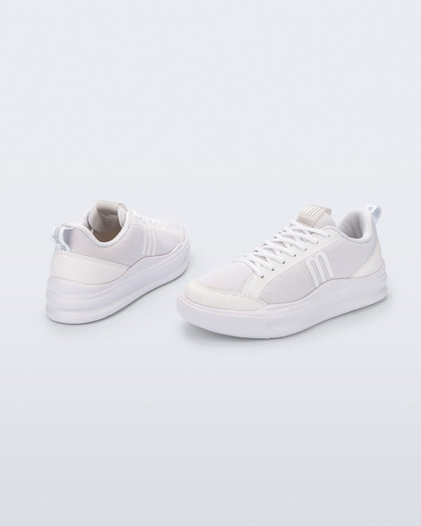 Back and angled view of a pair of white X Mood sneakers