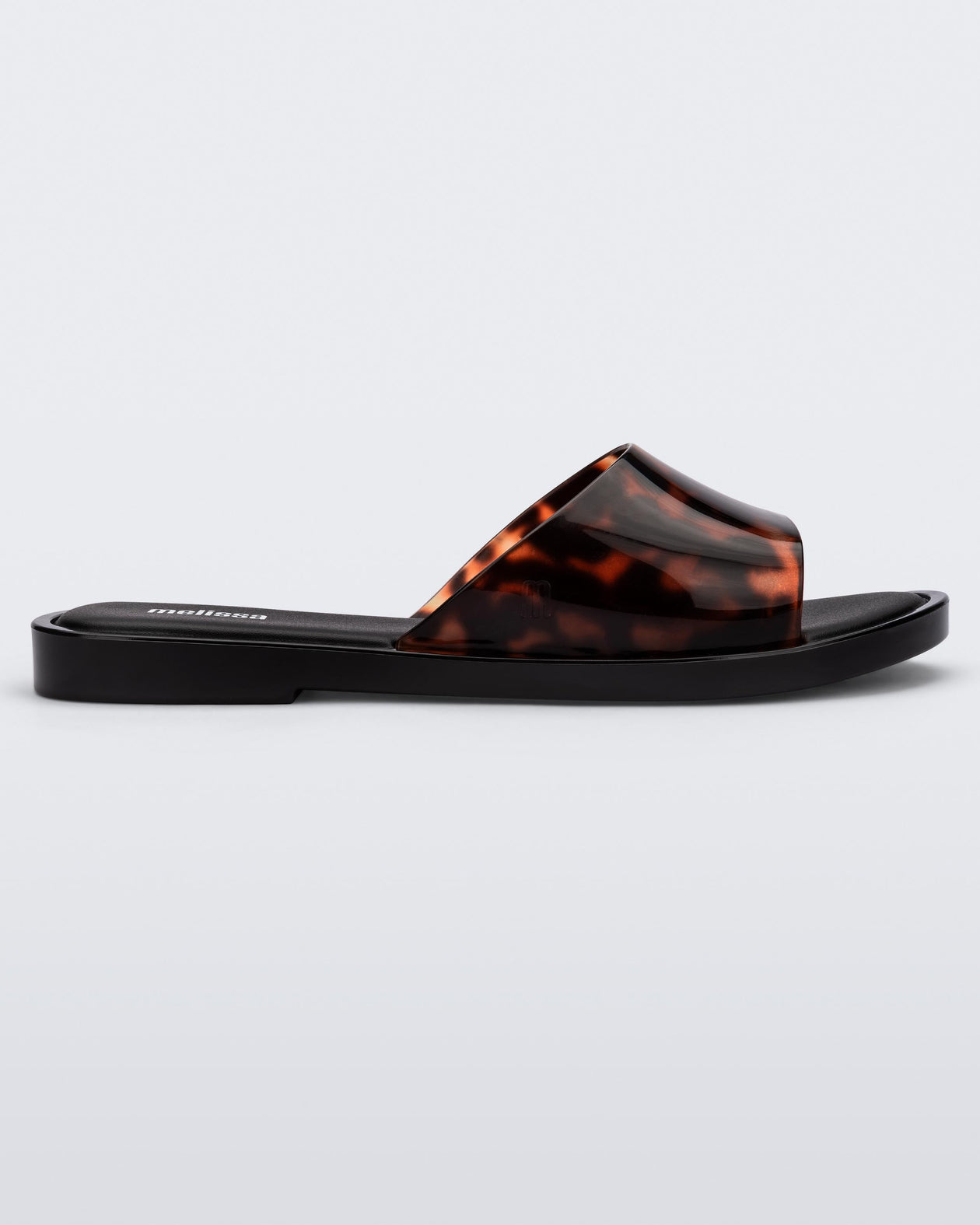 Side view of a black tortoiseshell Melissa Miranda slide