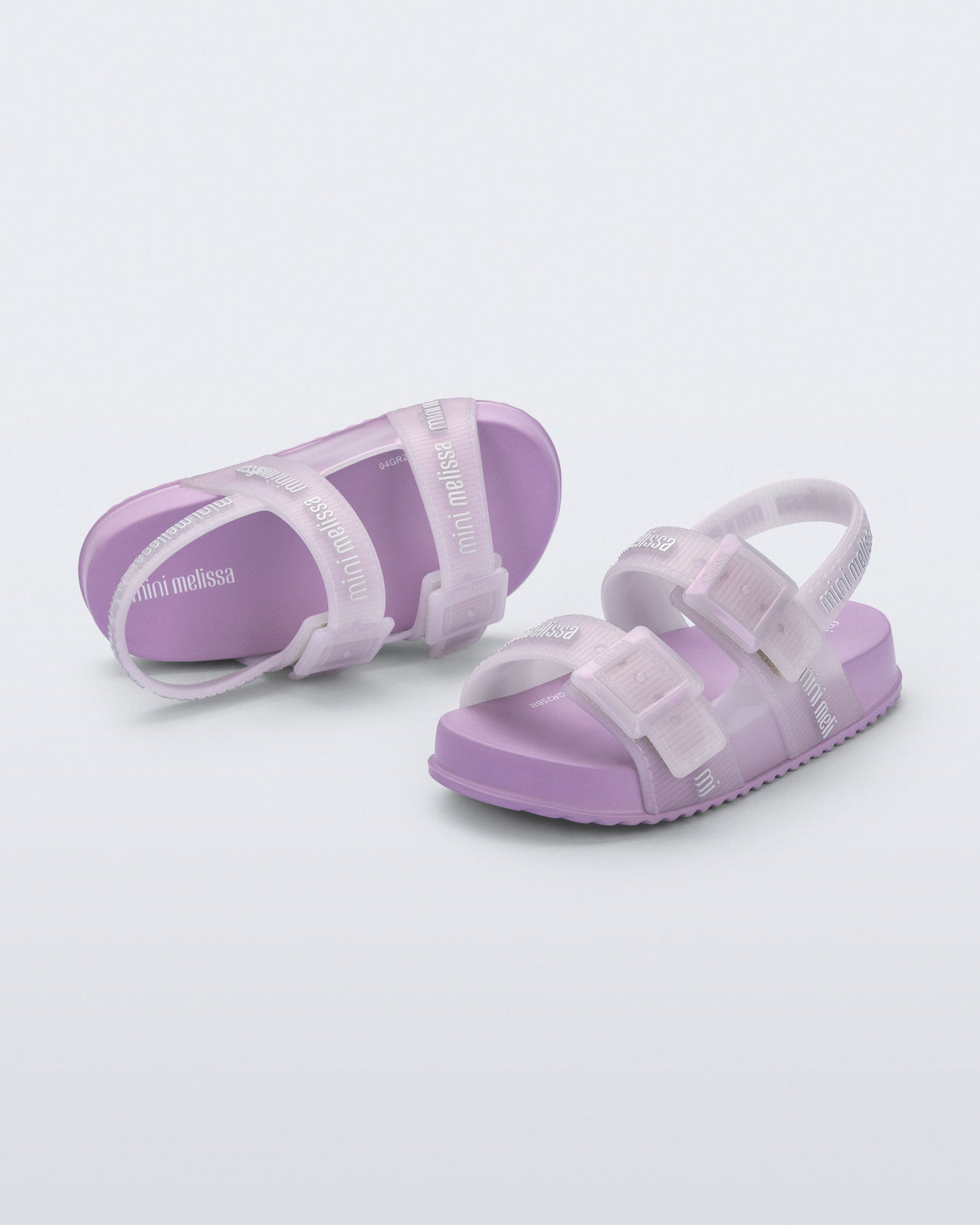 Top and angled view of a pair of lilac Cozy M Lover baby sandals