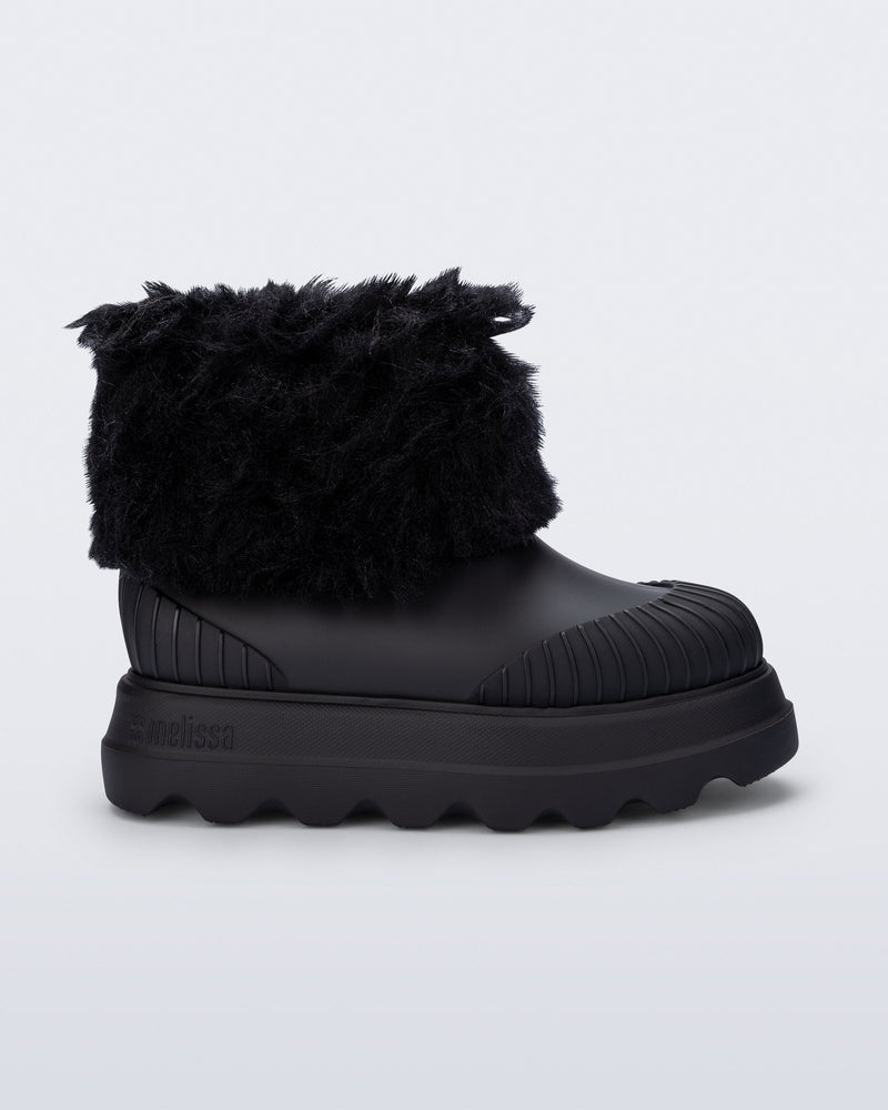 Side view of a black Warm Boot with fuzzy cuff and inside