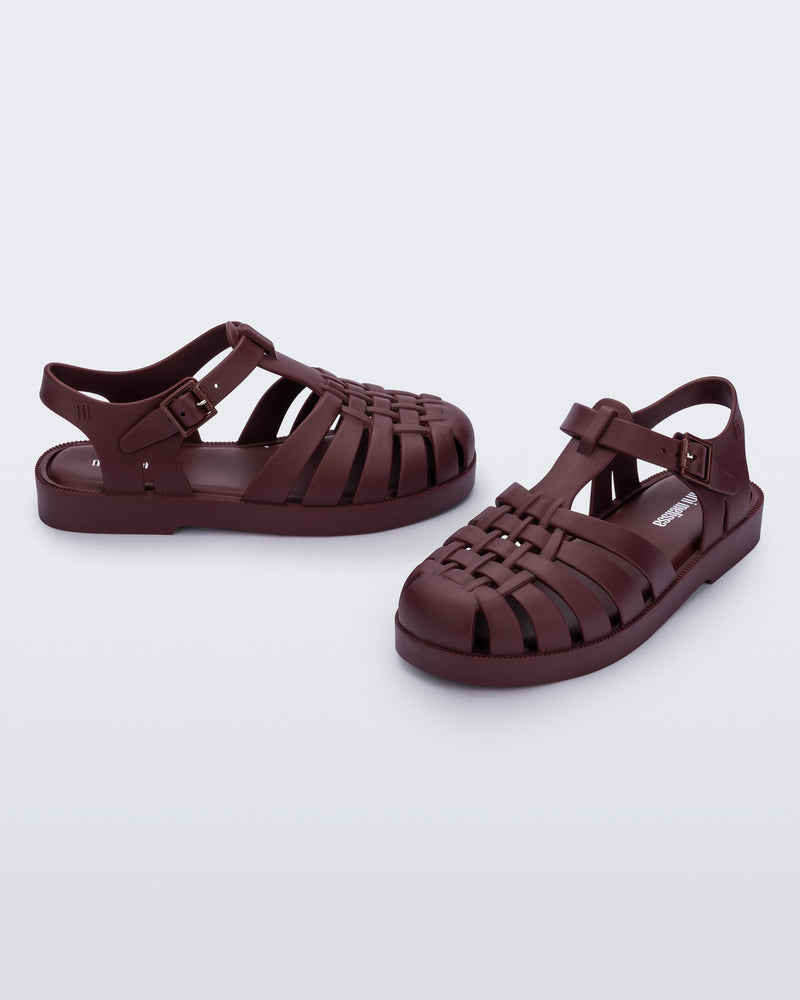 Front and back angled view of a pair of matte burgundy Possession kids fisherman sandals.
