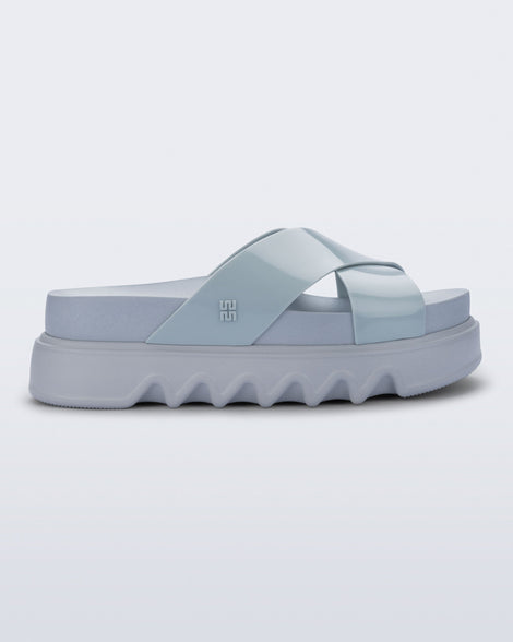 Side view of a blue Cozy Cross platform sandal with crisscross top straps