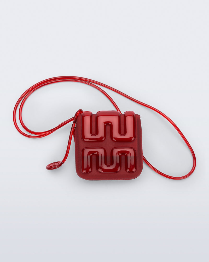 Back view of a red Jelly Wallet with inside pocket and zipper