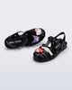 Top and angle view of a pair of black Possession + Hello Kitty and Friends fisherman sandals with Hello Kitty and friends on the upper