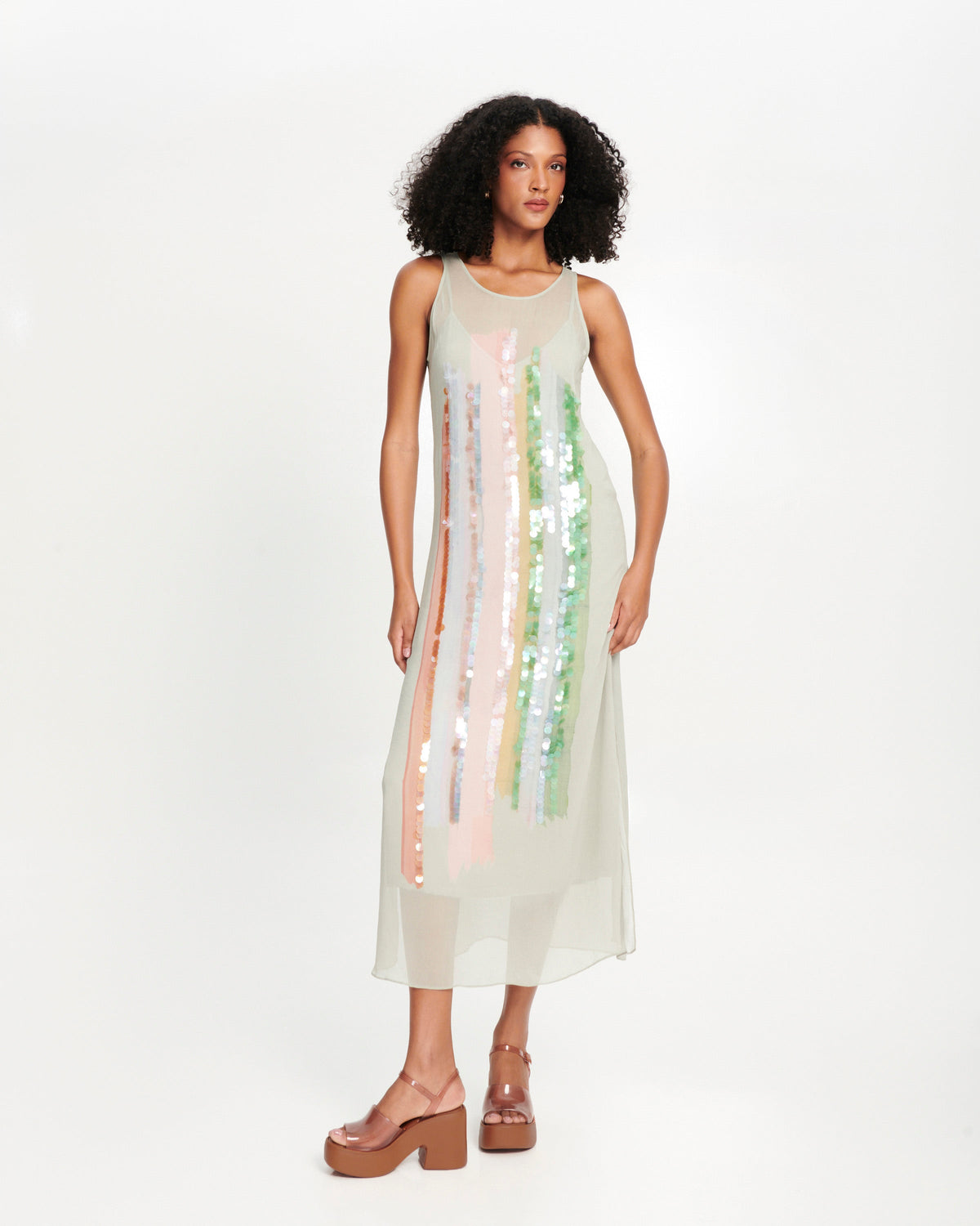 Model in a grey slip dress wearing a pair of clear brown Lina platform heels