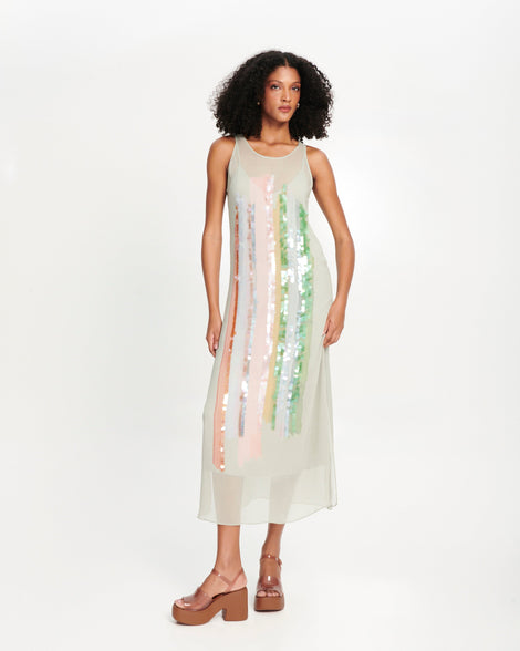 Model in a grey slip dress wearing a pair of clear brown Lina platform heels