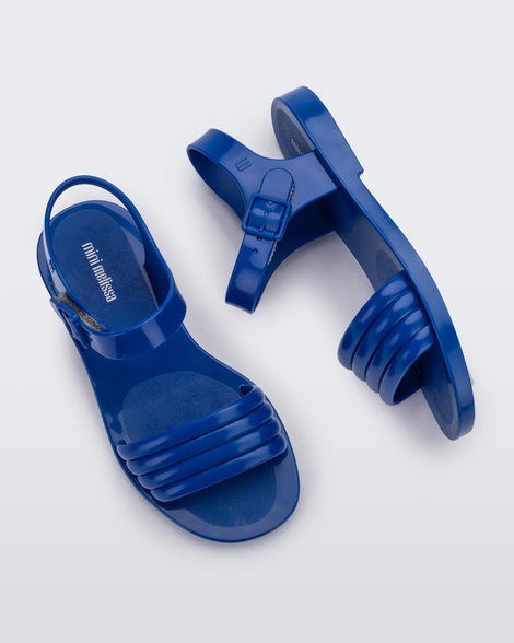 Side and top view of a pair of blue Mar Wave kids sandals.