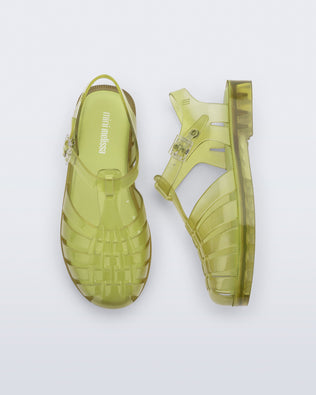 Top and side view of a pair of transparent green Possession fisherman kids sandals