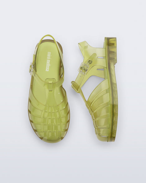 Top and side view of a pair of transparent green Possession fisherman kids sandals