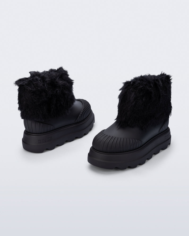 Back and angled view of a pair of black Warm Boot with fuzzy cuff and insole