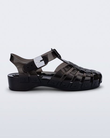 Side view of a black Possession Pescura + Scholl fisherman sandal with white bottom sole