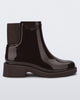Side view of a dark brown Chelsea boot