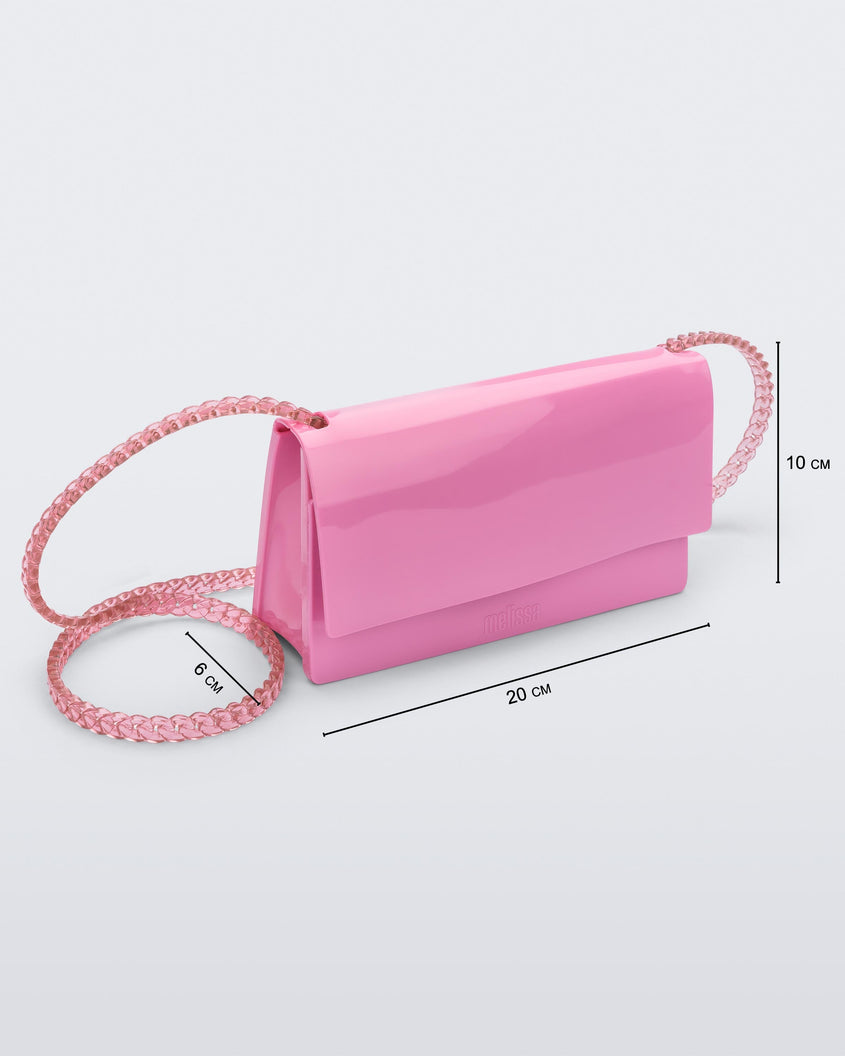 Angled view of the Melissa party handbag in pink with measurements of 20 cm width, 10 cm height, 6 cm depth