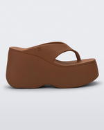 Side view of a brown Free Thong Wedge platform flip flop sandal