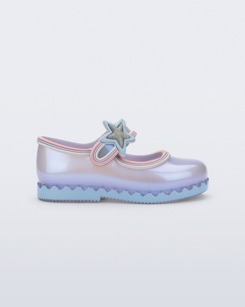 Side view of a  pearly blue Hip Ballerina Star baby flat with star on upper strap
