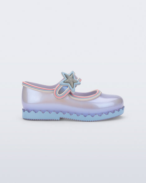 Side view of a  pearly blue Hip Ballerina Star baby flat with star on upper strap