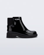 Side view of a black Chelsea II kids boot