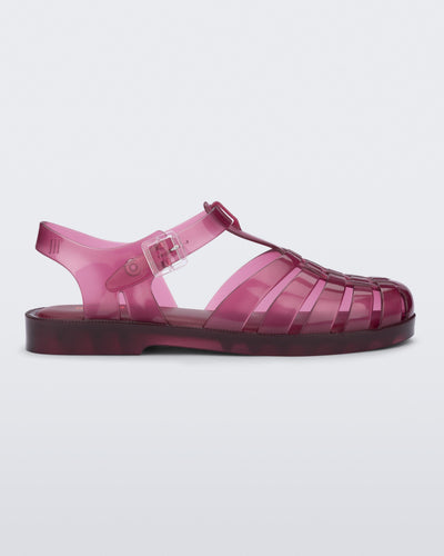 Side view of a clear cranberry Possession fisherman sandal