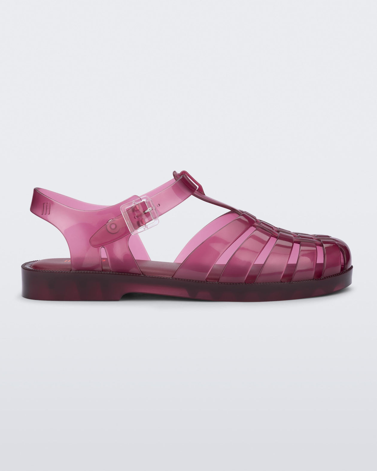 Side view of a clear cranberry Possession fisherman sandal