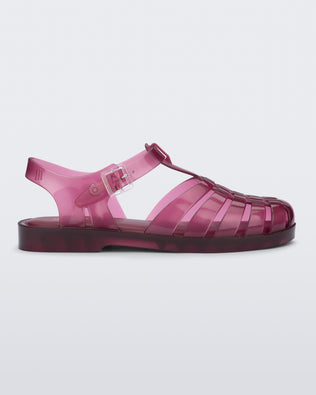 Side view of a clear cranberry Possession fisherman sandal