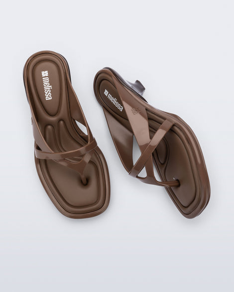 Top and side view of a pair of brown Layla kitten heel flip flops