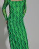 Video with no sounds of a model in a green dress wearing a pair of white Kick Off Sandals