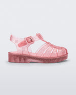 Side view of a Glitter Pink Mini Melissa Possession sandal with several straps and a pink glitter base.