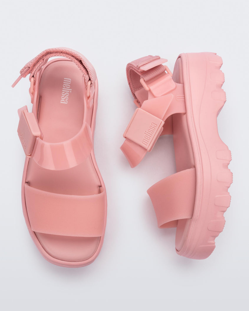 Top and side view of a pair of pink/pink Melissa Kick Off Platform Sandals with a front and ankle strap.
