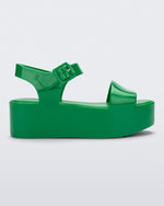 Side view of a green Melissa Mar Platform sandal with two straps.