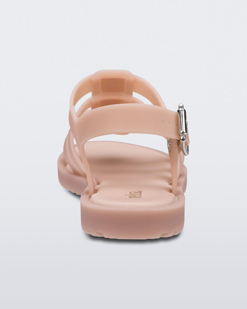 A back view of a pink Melissa Flox sandal with straps.