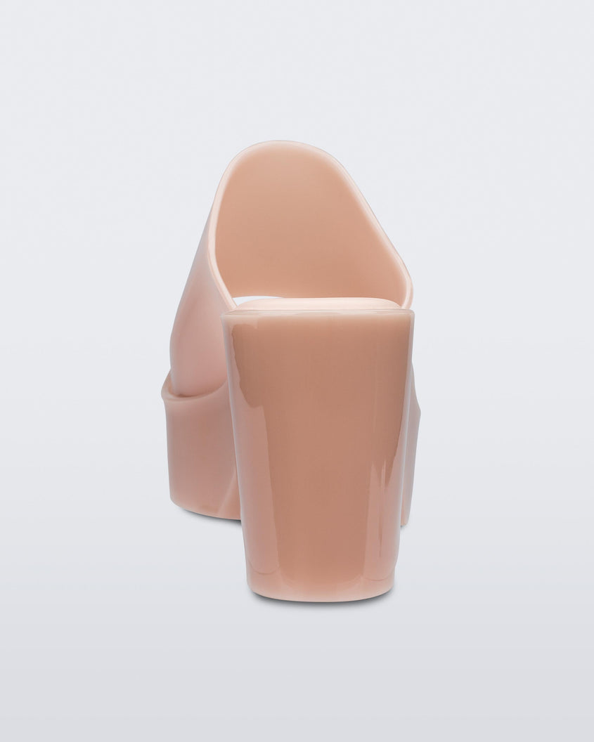 Back view of a pink Melissa Mule platform heel on a white background.